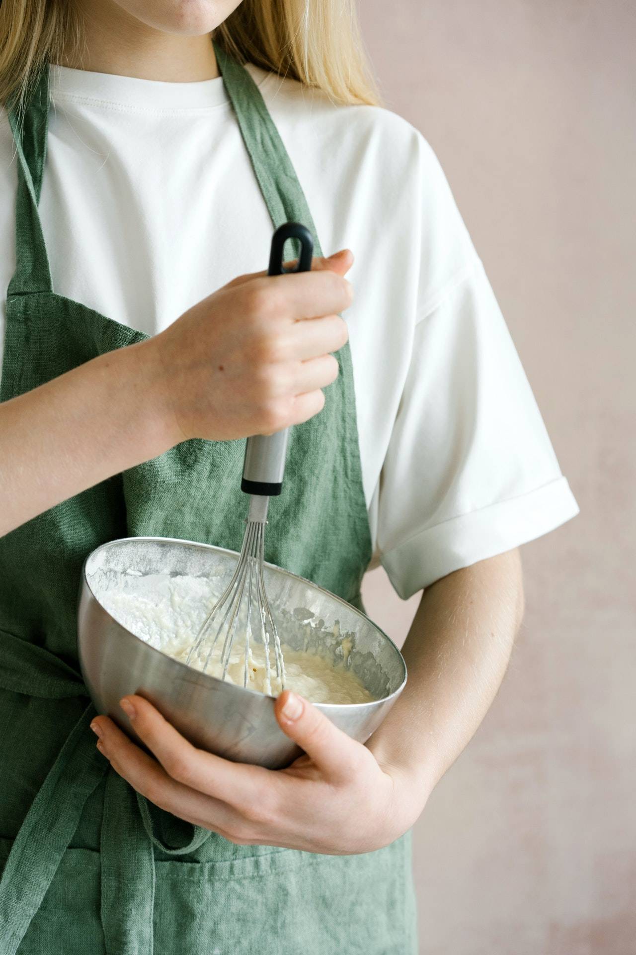 A person mixing ingredients in bowl with whisk - Dato Darren Yaw